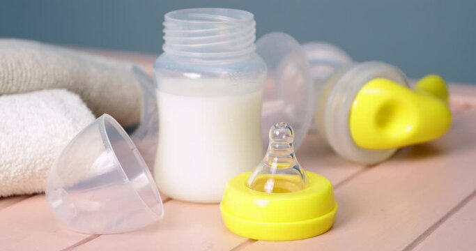 Breast pump and baby accessories on table