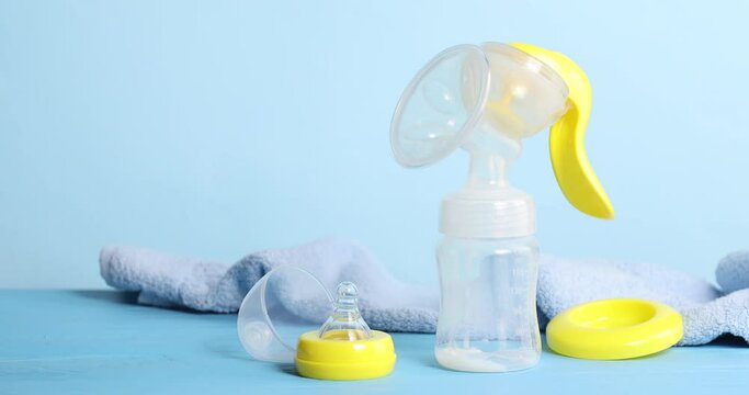 Breast pump and towel on table
