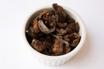 Jar with dry funghi mushroom isolated on white background