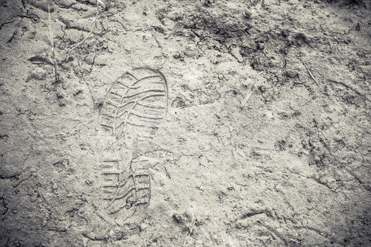Shoe footprint imprints on ground