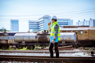 Portrait engineer under inspection and checking construction process railway and checking work on...