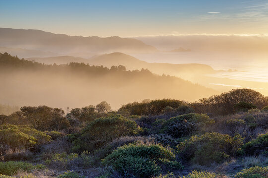 Dramatic Foggy Sunset over Pacifica via Milagra Ridge. Pacifica, San Mateo County, California, USA.