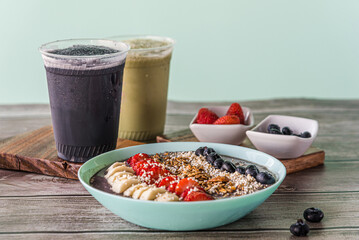 Tasty homemade oat with fruits on blue table. Healthy breakfast
