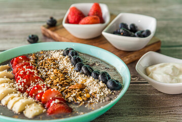 Tasty homemade oat with fruits on blue table. Healthy breakfast
