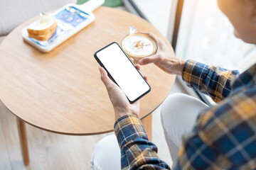 cell phone blank white screen mockup.woman hand holding texting using mobile on desk at office.background empty space for advertise.work people contact marketing business,technology