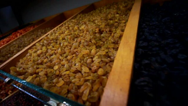 Raisin Grains In A Market Shelves Sliding Close Up Shot.