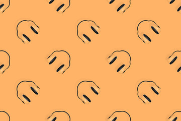 Headphones seamless pattern. Seamless pattern on the theme of headphones, music.