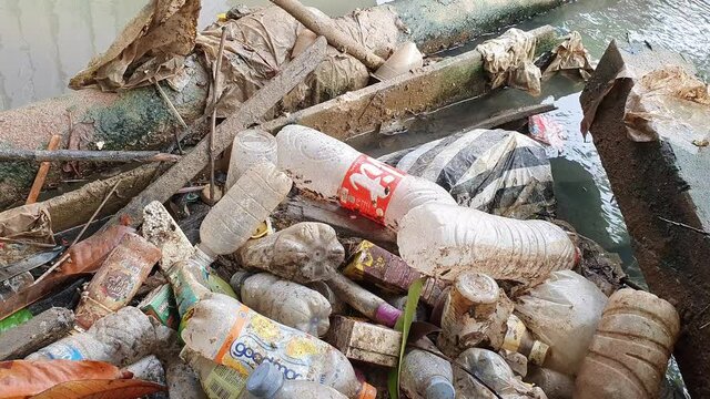 Tenggarong Indonesia, Januari 2021, plastic trash garbage clogging the sewer, causing flood, environmental pollution