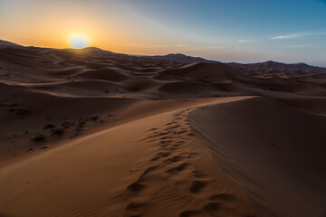 Obraz na płótnie Canvas Scenic View Of Desert Against Sky During Sunset