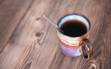 A cup of black tea on the table