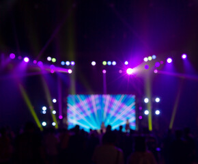 Fototapeta na wymiar Bright colorful stage lights of blur background, Bokeh concert light