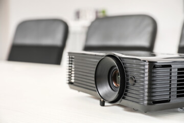 Video projector on table in conference hall, closeup