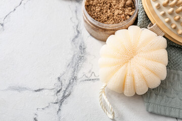 Bath sponge and natural cosmetics on light background