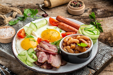 English breakfast with sausage, eggs and beans, Delicious breakfast or snack, Food recipe background. Close up