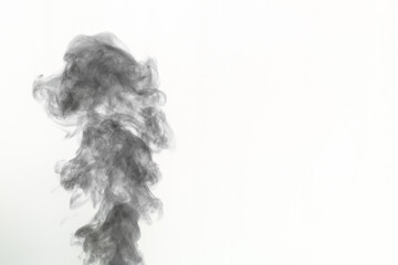 Black smoke isolated on white background, inverted frame, copy space. Mystical, curly smoke for...