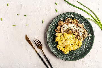 Scrambled Egg for Breakfast. Fried egg with Mushrooms and Cottage Cheese on plate, top view, copy space