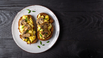 Scrambled eggs French toast with mushrooms, Top view, banner, overhead