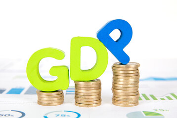 A row of growing euro coins and English words GDP model on a financial chart