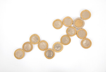 Rising arrow composed of euro coins on white background