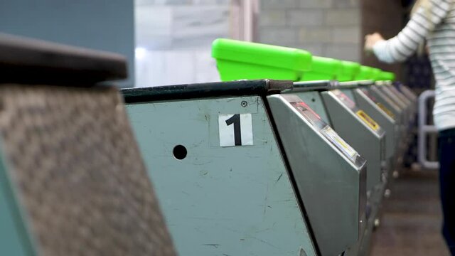 Entrance through turnstile to subway. Validator or ticket control. Contactless reader at gates of metro