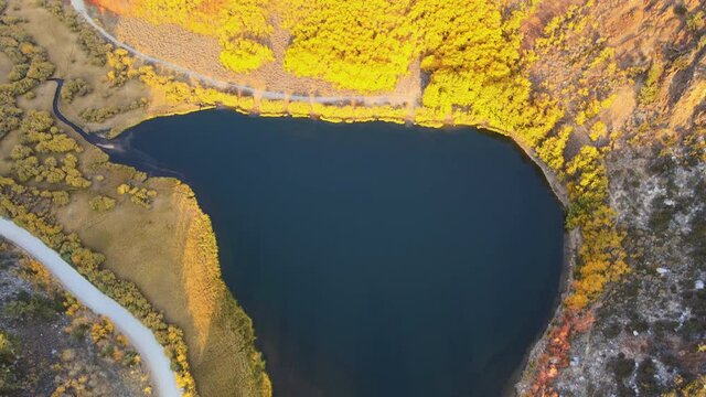 Cinematic aerial shot of colorful fall foliage at North Lake in Eastern Sierra in California at 60fps