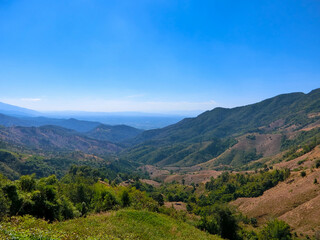Fototapeta na wymiar Mountain valley view and blue sky of Doi Sakard,Nan Thailand