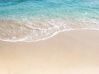 Fototapeta na wymiar Sea view of tropical beach and soft waves with sunlight at summer seasonal