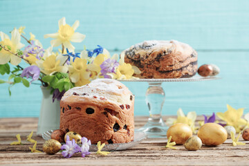 Easter cakes and eggs on blue  wooden background