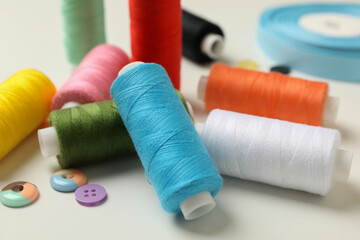 Sewing supplies on white background, close up