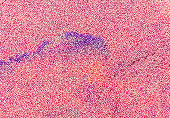 Texture of multi-colored slime with foam balls. Abstract background of educational children's toys