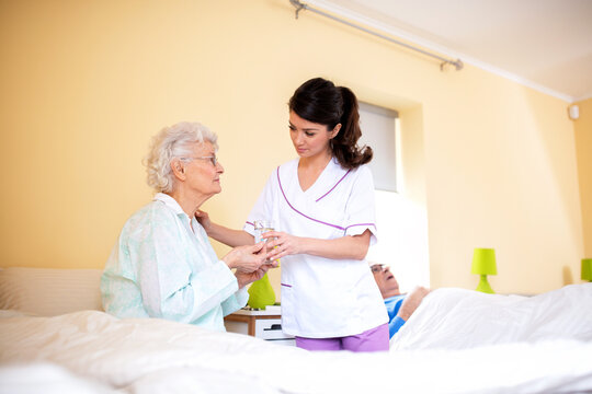 Two ladies working together, doctor and her nursing facility patient