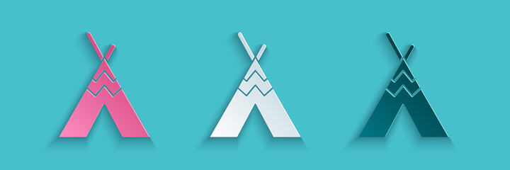 Paper cut Traditional indian teepee or wigwam icon isolated on blue background. Indian tent. Paper art style. Vector. © Vadim