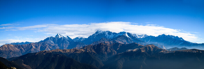 Fototapeta na wymiar panorama of the mountains. Snow mountain peaks. Panoramic view of Himalaya mountain. 