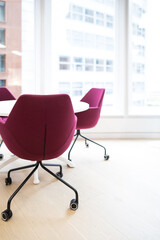 Meeting room professional board room lit by natural light chairs and table