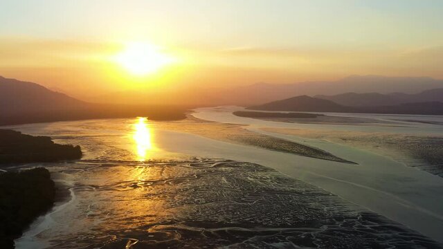Aerial view of landscape view of low tide seashore and mangrove forest in morning