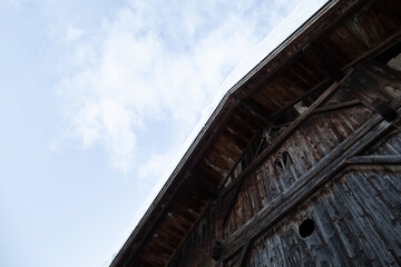 Fototapeta na wymiar Old wooden barn in East Tyrol in Austria. Low angle