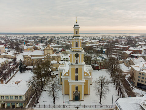Liepaja city covered by snow Aerial photo.  Saints trinity (holy trinity) church in Liepaja. Snowy day in Liepaja. Aerial photo of Liepaja