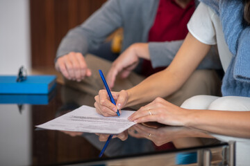 Woman signing a legal petition for divorce