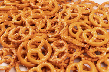 a pile of yellow pretzels piled up nearby