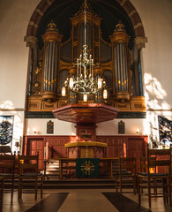Interior of cathedral in Schagen, Netherlands | Pipe organ, chandelier, podium