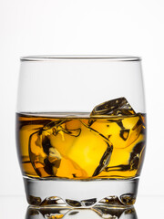 Whisky on the rocks on white background
