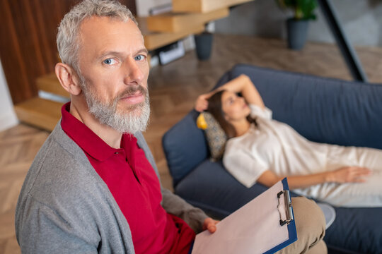 Professional psychotherapist conducting a session with a woman