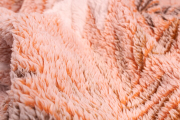 unevenly folded orange plaid with white cover