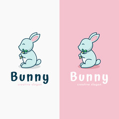 Adorable bunny holding carrot logo template