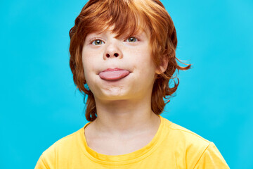 redhead boy showing tongue close-up cropped view  © SHOTPRIME STUDIO