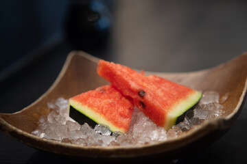 Close up of sliced watermelon on ice served after finished eating