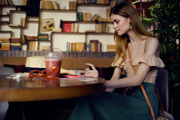 pretty woman in restaurant rest glass with drink lifestyle