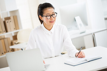 Portrait of asian business woman at workplace in office