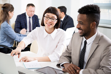Multy-ethnic group of business people working with computer at office