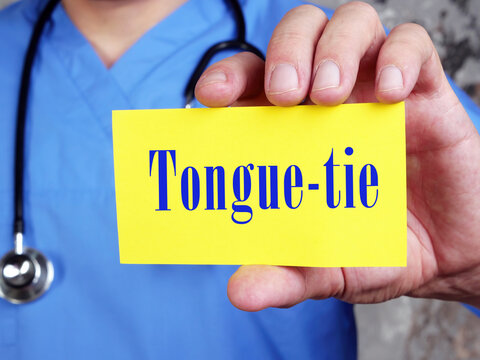 Medical concept about Tongue-tie with inscription on the piece of paper.